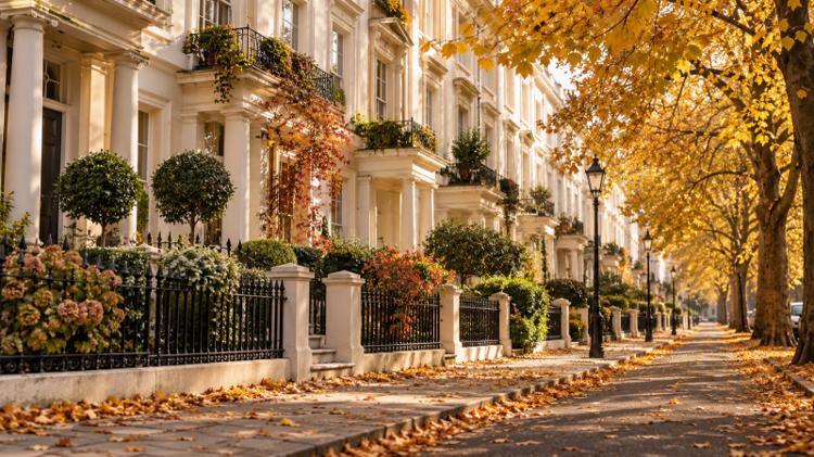 A leafy residential street of cream Regency villas with front gardens, under autumn trees